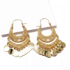 gold dangle earrings on a white background